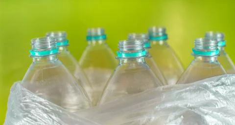 Bottlenecks of a pack of 8 empty and recyclable plastic water bottles, with n Foto stock