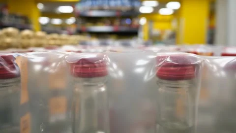 Bottles with alcohol close-up in a store. Bottle neck and cork Stock Footage 262561913
