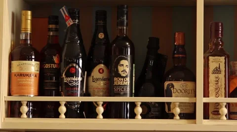 Bottles with alcohol on a shelf Stock Footage 46070854