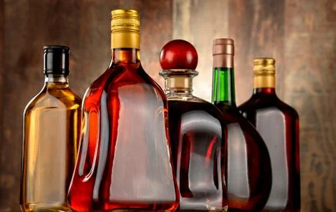 Bottles of assorted alcoholic beverages. Stock Photos