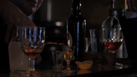 Bottles on Bar, Mixing Drinks at 1920s / 30s Speakeasy - Gangsters &amp; Mobsters Video stock 103623946