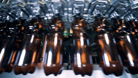 Bottles of beer are getting transported by the conveyor Stock Footage 102725566