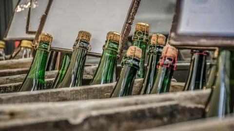 Bottles of cider in boxes Stock Photos