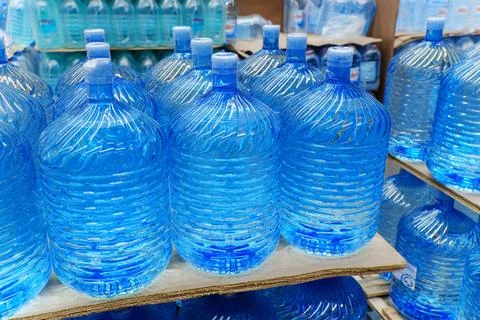 Bottles with clean water in a hyper package. Sale of drinking water. Select.. Stock Photos