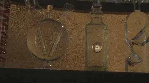 Bottles with clock (Canon Log) Видео 54348228