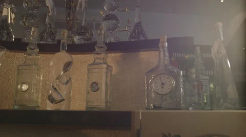 Bottles with clock (Canon Log) Видео 54348324