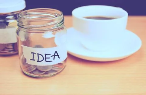 Bottles of coins for cost saving in the future Stock Photos