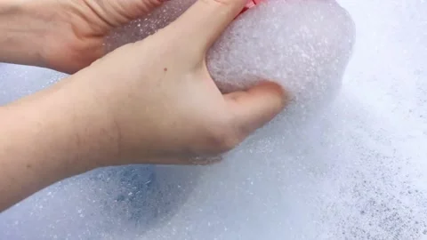 Bottles of detergents float in the foam. The concept of the dangers of household Stock-Footage 146720260
