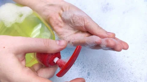 Bottles of detergents float in the foam. The concept of the dangers of household Stock Footage 146720308