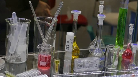 Bottles with different-flowered liquids green Видео 120141357