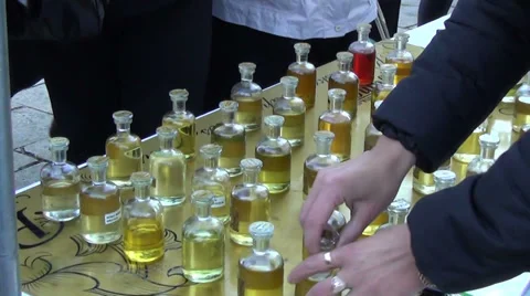 Bottles different scents exotic types of essential oils for body Stock Footage 34082101