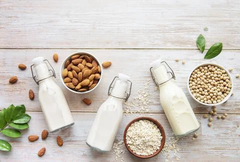 Bottles with different vegetable milk Stock Photos