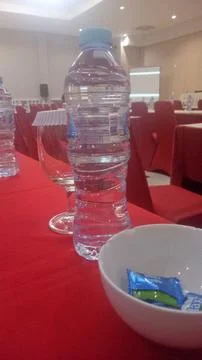 Bottles on the dining table in the work meeting room Stock Illustration