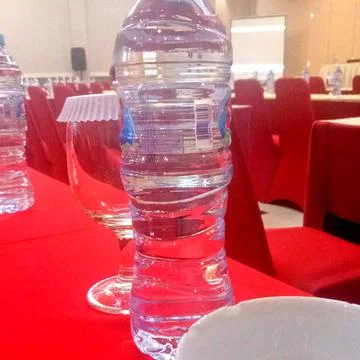Bottles on the dining table in the work meeting room Stock Photos