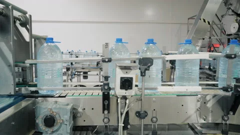 Bottles with drinking water on moving automatic conveyor Stock Footage 160714083