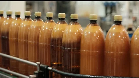 Bottles full of fresh beer transported by production line Stock Footage 147019923