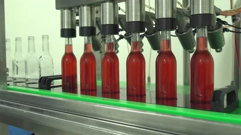 Bottles going through bottling machine 스톡 동영상 132052360