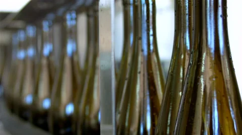 Bottles on a industrial machine. Bottling machine. Stock Footage 62471601
