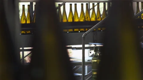 Bottles on a industrial machine. Bottling machine. Видео 62473755