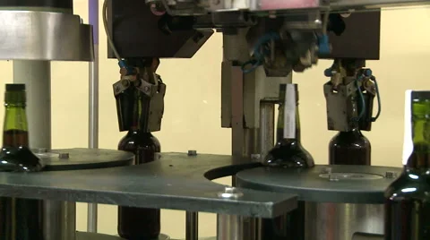 Bottles on a industrial machine. Bottling machine. Video stock 63226011