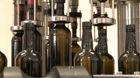 Bottles on a industrial machine. Bottling machine. Stock Footage 63226479