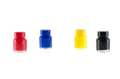 Bottles of ink in cmyk colors Stock Photos