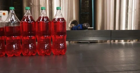 Bottles moving in production line Stock Footage