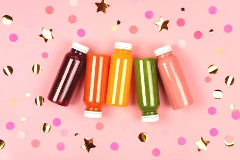 Bottles of multicolored smoothies Stock Photos