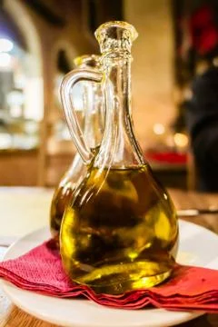 Bottles of organic extra virgin olive oil in Italian restaurant Stock Photos