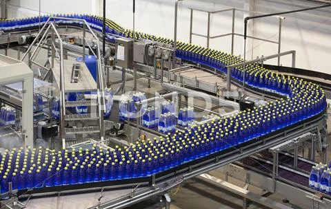 Bottles On Production Line In Bottling Plant