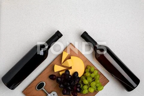 Bottles of red and white wine on white background from top view Stock Photos