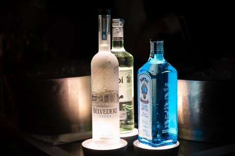 Bottles of spirits placed on a light base Stock Photos