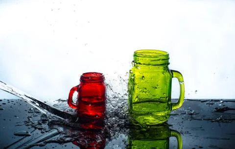 BOTTLES SPLASH BY WATER Stock Photos