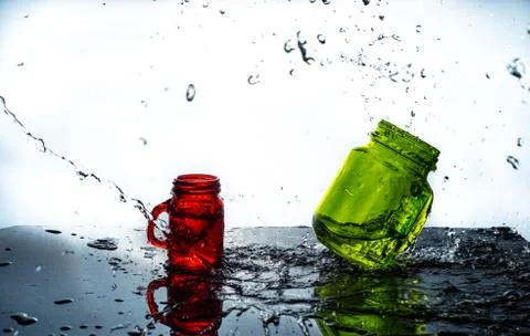 BOTTLES SPLASH BY WATER Stock Photos