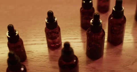Bottles of various fragrant oils in lab Stock Footage 260983460