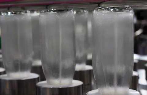 Bottles in washing process Stock Photos