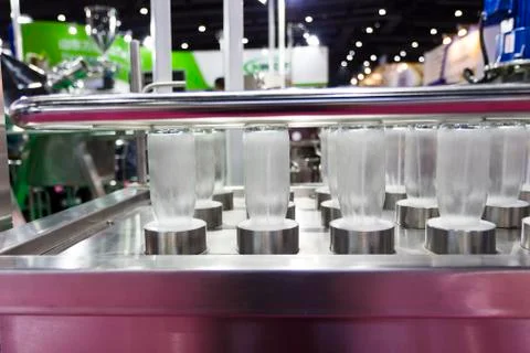 Bottles in washing process Stock Photos