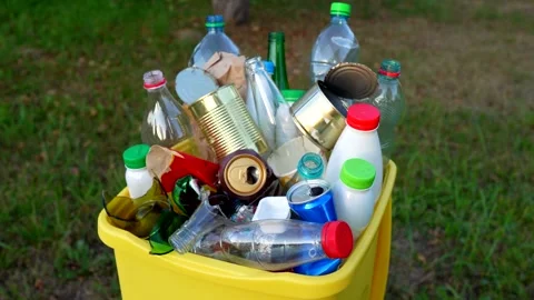 Bottles in Waste container. Waste sorting for Recycling. Video stock 286381553