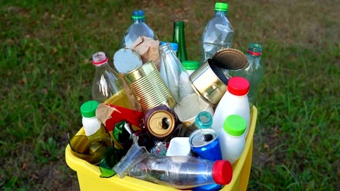 Bottles in Waste container. Waste sorting for Recycling. Stock Footage 286427404
