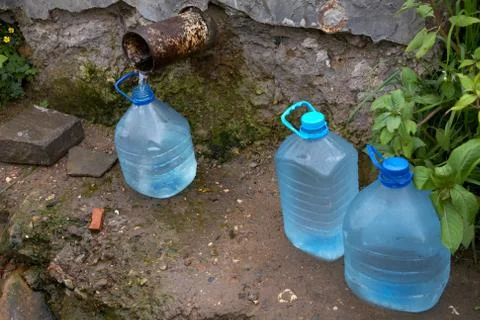 Bottles with water from a spring Stock Photos