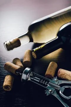 Bottles of wine and corkscrew Stock Photos