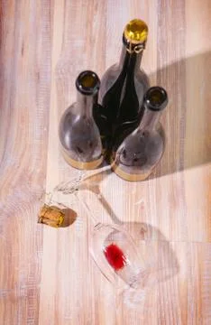 Bottles with wine and empty wine glass Stock Photos