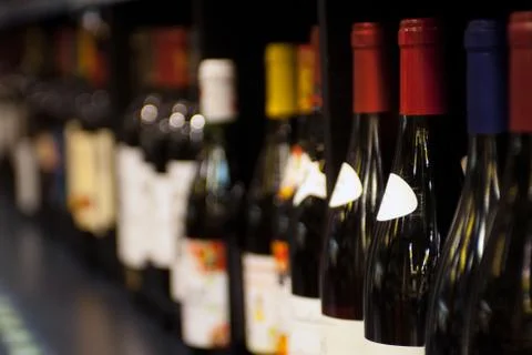 Bottles of wine on the shelf. selective focus Stock Photos