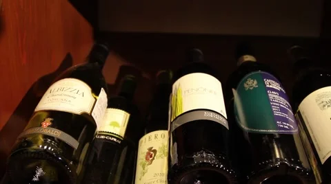 Bottles of wine on the shelves Stock Footage 46069959