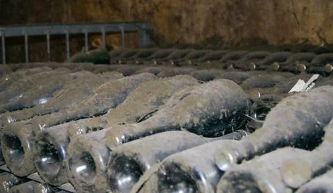 Bottles of wine in storage. Stock Photos