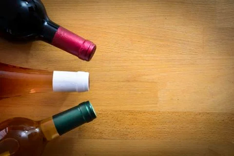 Bottles of wine on a wood table Stock Photos