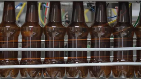 Bottles without labels go along the conveyor 스톡 동영상 240925669