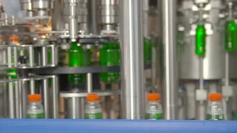 Bottling of lemonade in plastic bottles. Lemonade bottle conveyor industry. Video stock 76346158