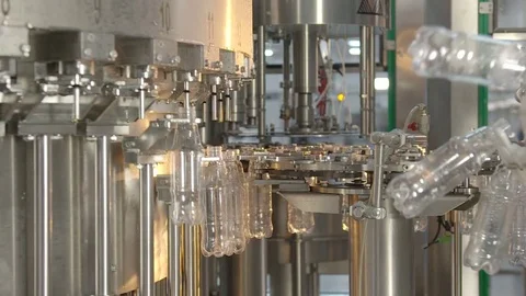 Bottling of lemonade in plastic bottles. Lemonade bottle conveyor industry. Video stock 76346386