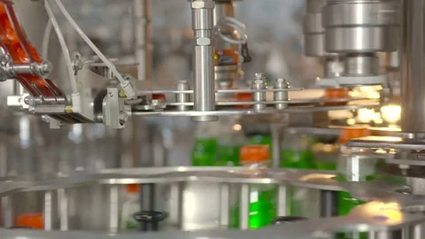 Bottling of lemonade in plastic bottles. Lemonade bottle conveyor industry. Video stock 76347572
